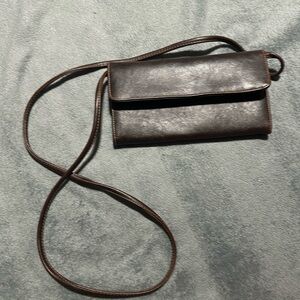 Brown clutch with removable strap.  Like new.
